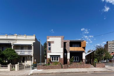 The large original house on the Marrickville site has been divided down the middle to create two dwellings with separate entries (Lots 1 and 2).