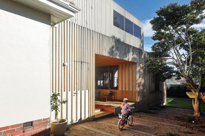 Where the timber battens cover the cladding they are the modern equivalent of an Art Deco element.