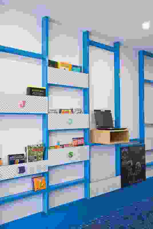 The studded wall incorporates shallow shelving for brochures.