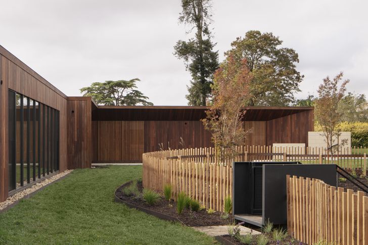 The house surrounds the remains of the site's previous residences, connecting the old and the new.